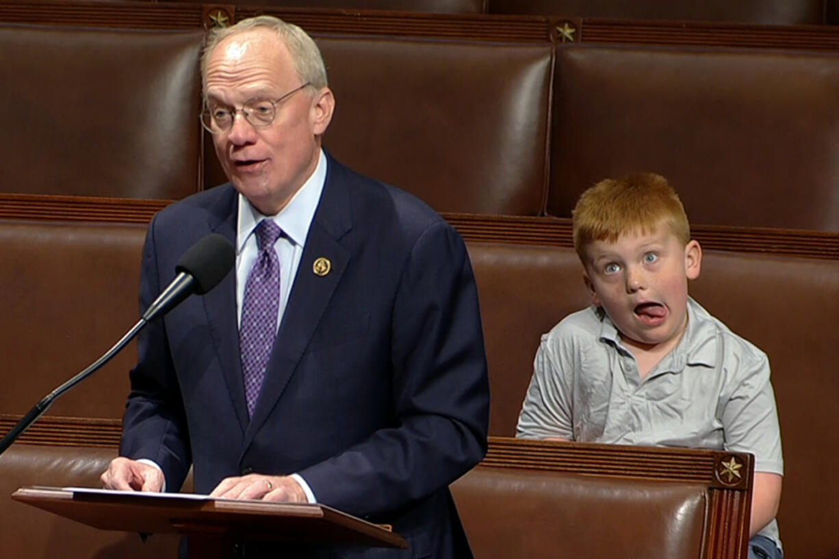 This image from House Television shows Rep. John Rose, R-Tenn., speaking on the floor of the House of Representatives Monday, June 3, 2024, in Washington, as his son Guy makes a face. When political kids upstage their parents, it brings a moment of levity to the official workings of government. It&rsquo;s also a solid case study on the sheer unifying power of humor.