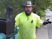 Magnet fisher James Kane exclaims as he reacts May 31 to the contents of a safe he pulled out of a pond, in Flushing Meadows Corona Park, in the Queens borough of New York.