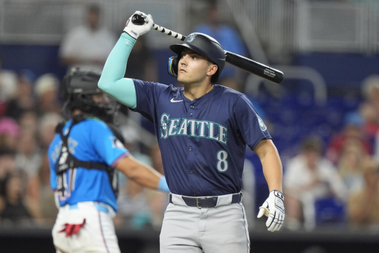 Seattle Mariners&#039; Dominic Canzone (8) reacts after he struck out swinging during the sixth inning of a baseball game against the Miami Marlins, Sunday, June 23, 2024, in Miami.