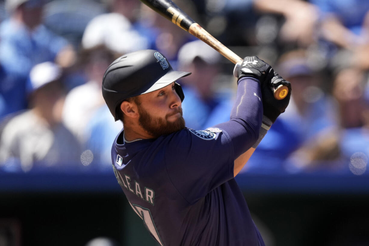 Seattle Mariners&#039; Tyler Locklear watches his RBI double during the seventh inning of a baseball game against the Kansas City Royals Sunday, June 9, 2024, in Kansas City, Mo.