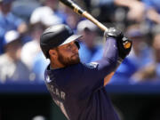 Seattle Mariners&#039; Tyler Locklear watches his RBI double during the seventh inning of a baseball game against the Kansas City Royals Sunday, June 9, 2024, in Kansas City, Mo.