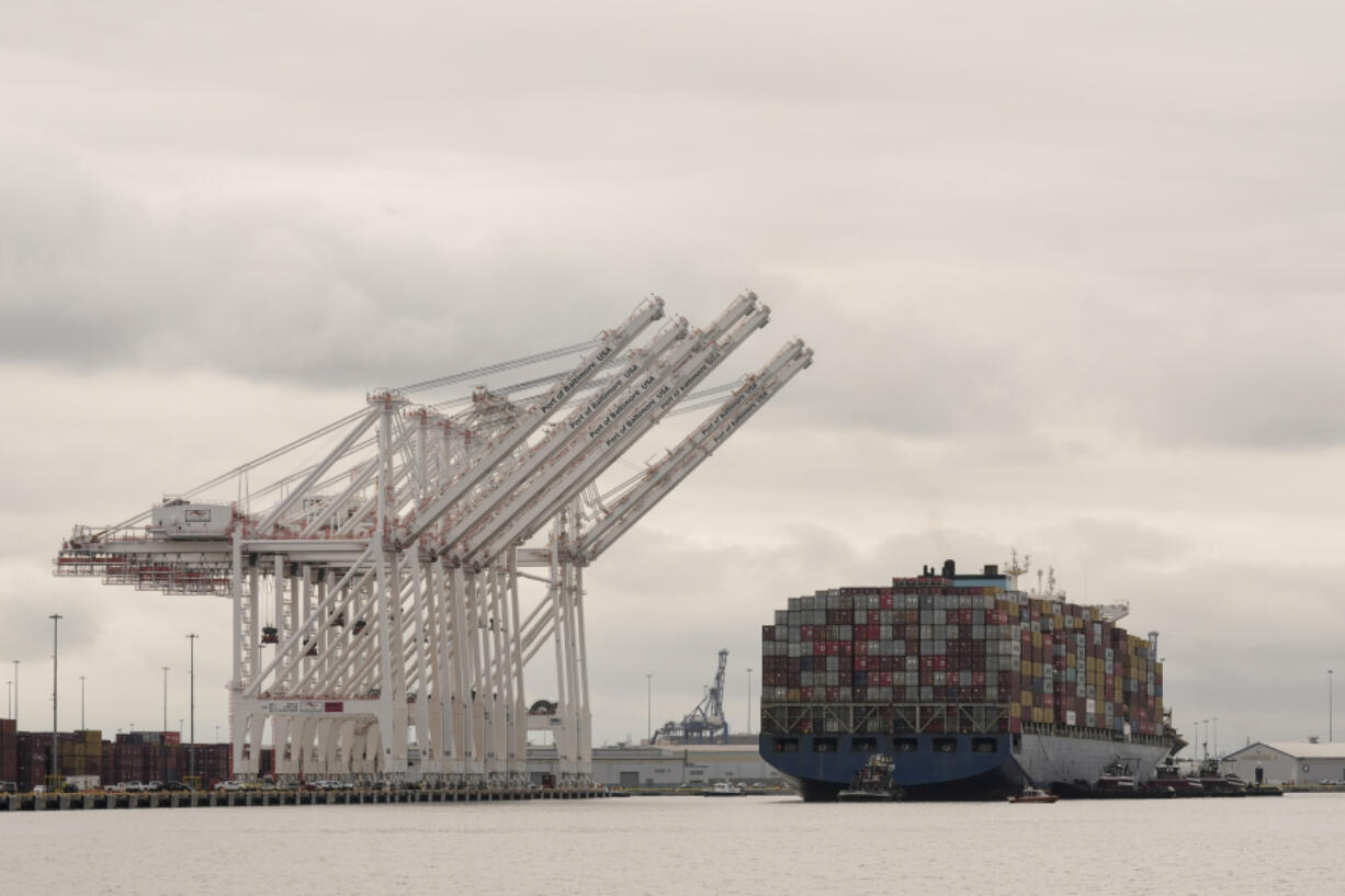 Tugboats escort the cargo ship Dali after it was refloated in Baltimore, Monday, May 20, 2024. The vessel on March 26 struck the Francis Scott Key Bridge causing it to collapse and resulting in the death of six people.