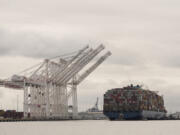 Tugboats escort the cargo ship Dali after it was refloated in Baltimore, Monday, May 20, 2024. The vessel on March 26 struck the Francis Scott Key Bridge causing it to collapse and resulting in the death of six people.