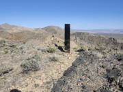 This photo provided by Las Vegas Metropolitan Police Department shows a monolith near Gass Peak, Nevada on Sunday, June 16, 2024.  Jutting out of the rocks on a remote mountain peak near Las Vegas, the glimmering rectangular prism&rsquo;s reflective surface imitates the vast desert landscape surrounding the mountain peak where it has been erected.