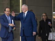Dallas Cowboys owner and general manager Jerry Jones, middle, waves as he leaves federal court Monday, June 17, 2024, in Los Angeles. Jones testified in a class-action lawsuit filed by &ldquo;Sunday Ticket&rdquo; subscribers claiming the NFL broke antitrust laws.
