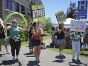 Nurses protest outside Providence Milwaukie Hospital, Wednesday, June 19, 2024, in Milwaukie, Oreg., during the second day of a planned three-day strike involving ore than 3,000 nurses at six Providence Health hospitals.