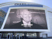 An image of Jerry West is displayed outside the Chase Center, Wednesday, June 12, 2024, in San Francisco. West, who was selected to the Basketball Hall of Fame three times in a storied career as a player and executive, and whose silhouette is considered to be the basis of the NBA logo, died Wednesday morning. He was 86.