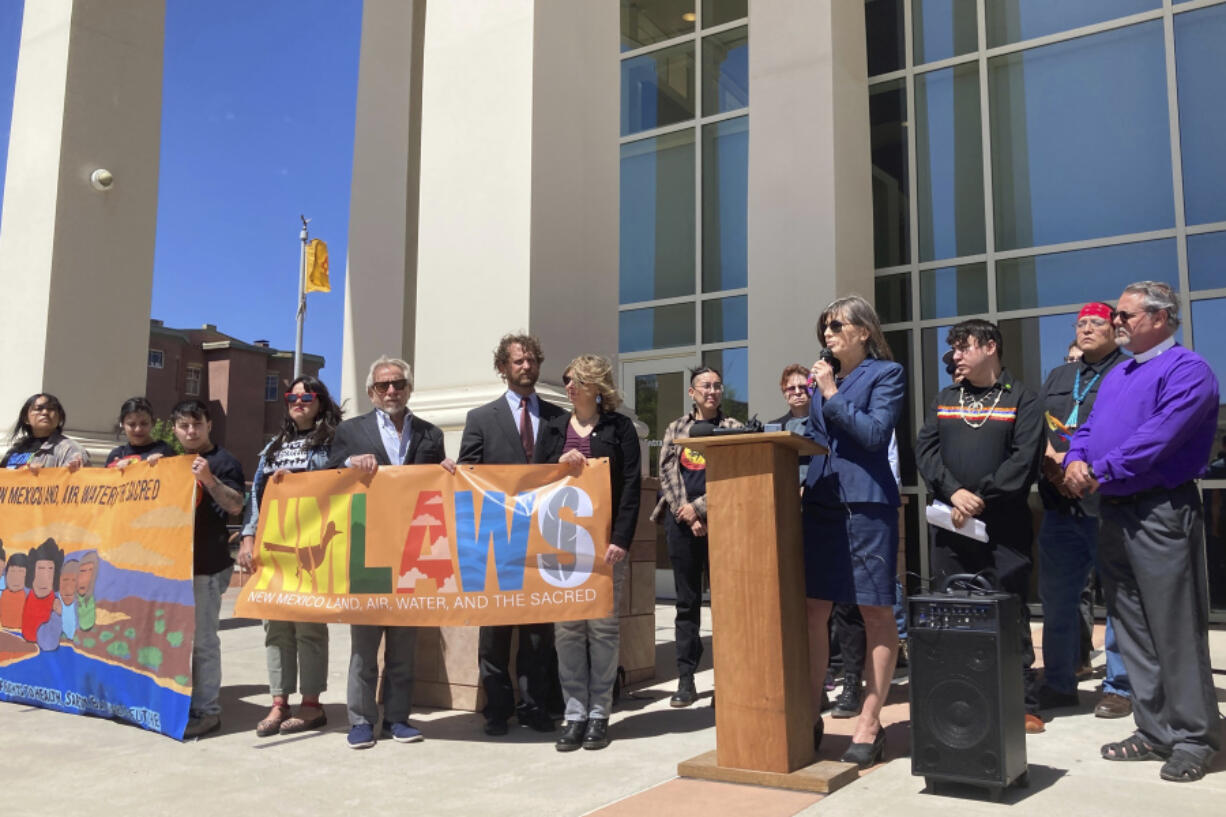 FILE - Attorney Gail Evans, of the Center for Biological Diversity&rsquo;s Climate Law Institute, speaks about pollution from oil and natural gas development and frustration with state oversight of the industry outside the state First District Court in Santa Fe, N.M., May 10, 2023. On Monday, June 10, 2024, a New Mexico judge cleared the way for a landmark lawsuit to proceed that alleges the state has failed to meet its constitutional obligations for protecting against oil and gas pollution. Environmental groups and Native Americans who live near oil wells in the No. 2 producing state in the U.S. initially filed the case in 2023.