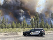 In this photo provided by the Deschutes County Sherriff&rsquo;s Office, smoke rises from a wildfire near La Pine, Oregon, Tuesday, June 25, 2024. Gusty winds fueled a rapidly growing wildfire just outside the central Oregon community of La Pine and prompted evacuations. (Sgt.