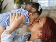 Victoria Cornejo Barrera, former head custodian for a high school in Columbia, South Carolina holds her four-month-old daughter Fernanda Cabrera at her home in Columbia, S.C., Monday, June 10, 2024. The Pregnant Workers Fairness Act entitled her to the types accommodations she had been seeking when she was pregnant.