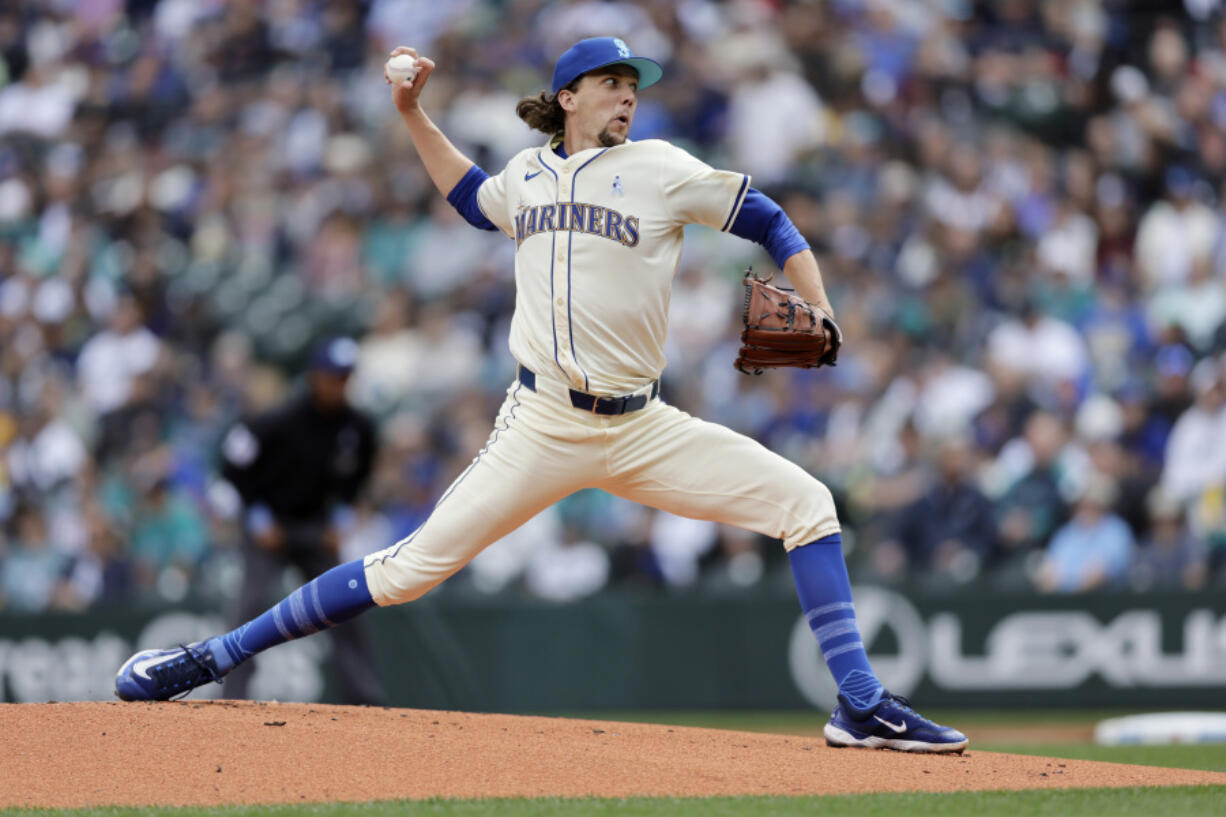 Seattle Mariners starting pitcher Logan Gilbert throws to a Texas Rangers batter during the first inning in a baseball game, Sunday, June 16, 2024, in Seattle.