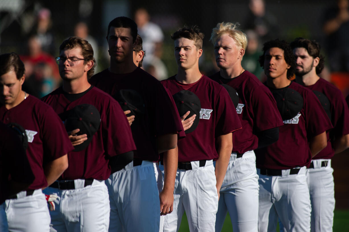 Ridgefield Raptors stand for the national anthem at an exhibition game against the Cowlitz Black Bears, on Thursday, May 30, 2024, at the Raptors home field.