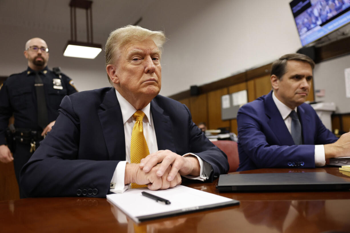 FILE - Former President Donald Trump sits in the courtroom for his trial at the Manhattan criminal court, Tuesday, May 21, 2024, in New York. As Trump attacked the U.S. criminal justice system following his guilty verdict, analysts say that his allegations could be useful to Russian President Vladimir Putin and other autocrats. (Michael M.