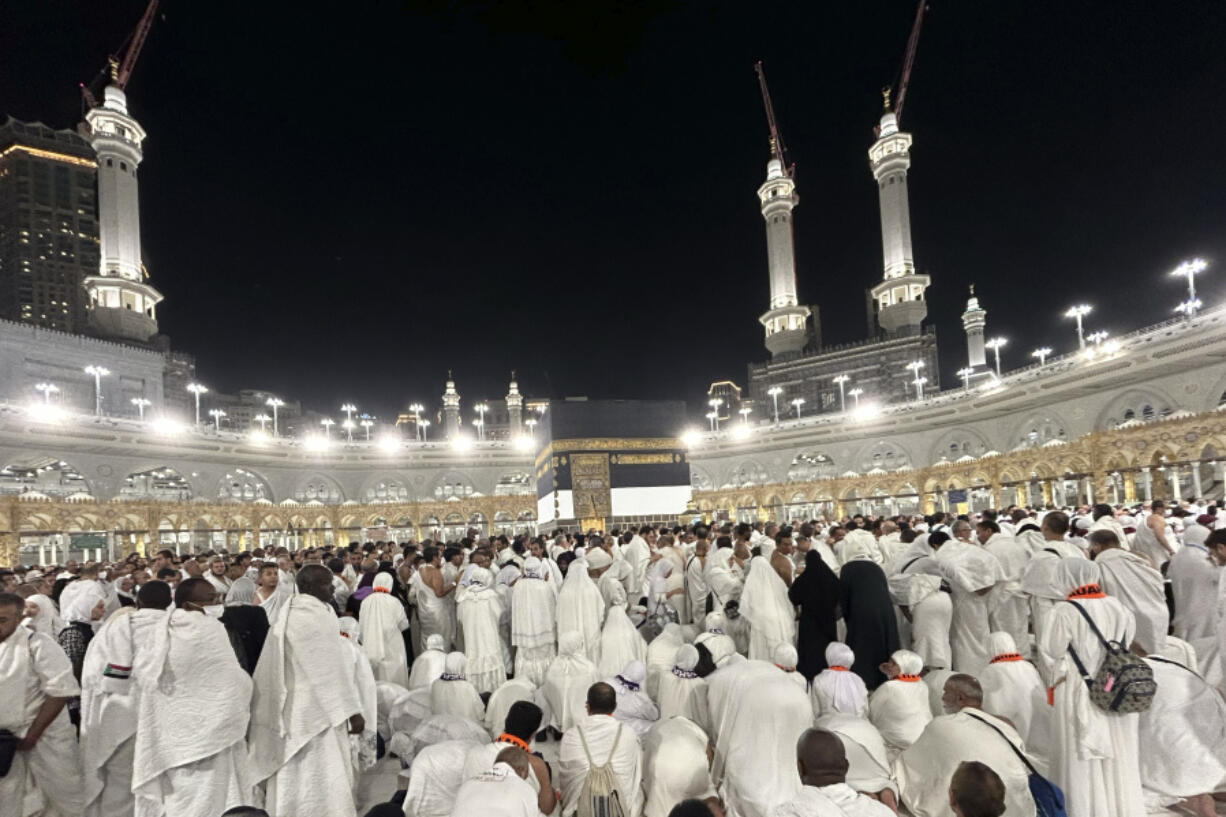 Muslim pilgrims circumambulate the Kaaba, the cubic building at the Grand Mosque, during the annual Hajj pilgrimage in Mecca, Saudi Arabia, Sunday, June 16, 2024. Masses of pilgrims on Sunday embarked on a symbolic stoning of the devil in Saudi Arabia. The ritual marks the final days of the Hajj, or Islamic pilgrimage, and the start of the Eid al-Adha celebrations for Muslims around the world.