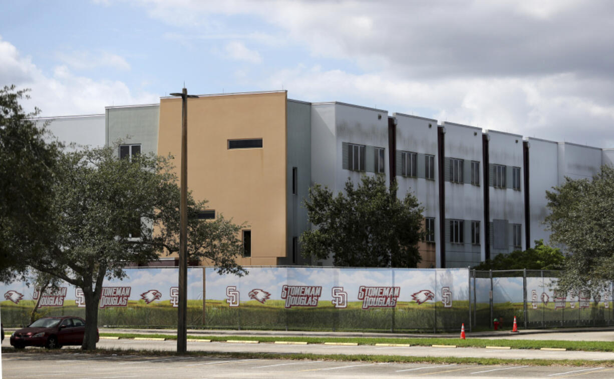 FILE - The 1200 building at Marjory Stoneman Douglas High School in Parkland, Fla., is seen, Oct. 20, 2021. Demolition of the building where 17 people died in the 2018 Parkland school shooting is set to begin, as crews will begin tearing down the three-story building at the high school on Thursday, June 13, 2024.