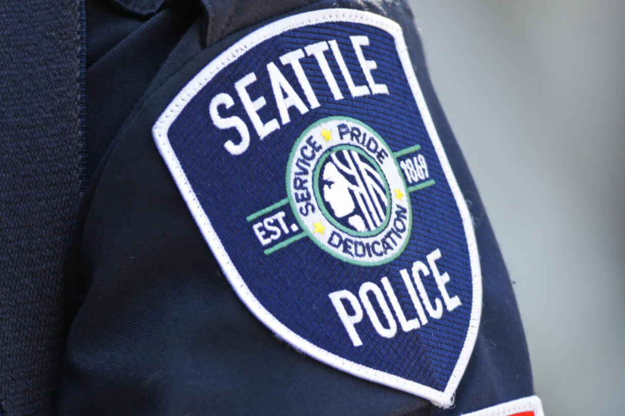 FILE - A Seattle Police Department patch is seen on an officer&#039;s uniform, July 17, 2016, in Seattle. The Washington Supreme Court heard arguments Tuesday, June 25, 2024 in a case that will decide whether the names of four Seattle police officers who attended events in the nation&rsquo;s capital on the day of the insurrection are protected under the state&#039;s public records law. (AP Photo/Ted S.