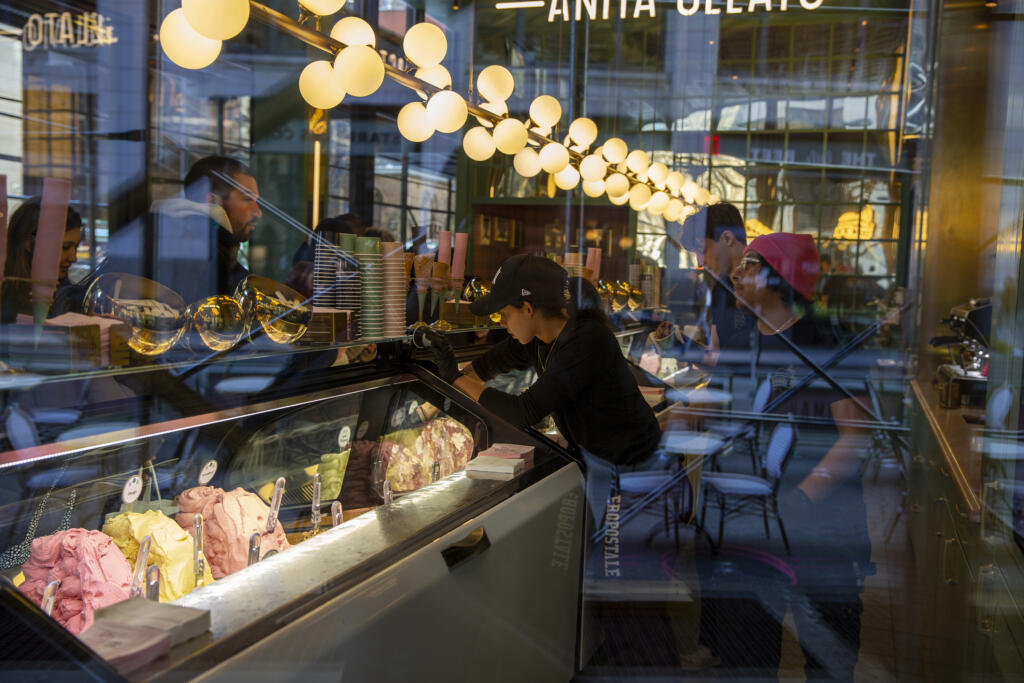 FILE - People working at a gelato shop serve customers in New York on February 18, 2024. Small businesses are increasingly concerned about payment fraud according to a survey from regional bank KeyBank.