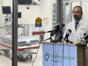 Dr. Paul Pugsley, medical director of the emergency department at Valleywise Health Medical Center in Phoenix, explains, Monday, June 3, 2024, how his staff will be working on a new protocol being adopted by the Phoenix Fire Department across its jurisdiction this summer in hopes of preventing some deaths from heat stroke. Known as cold water immersion therapy, the technique involves placing a patient with heat stroke inside a bag of ice slurry to bring down their body temperature long before the person arrives at a hospital emergency room.