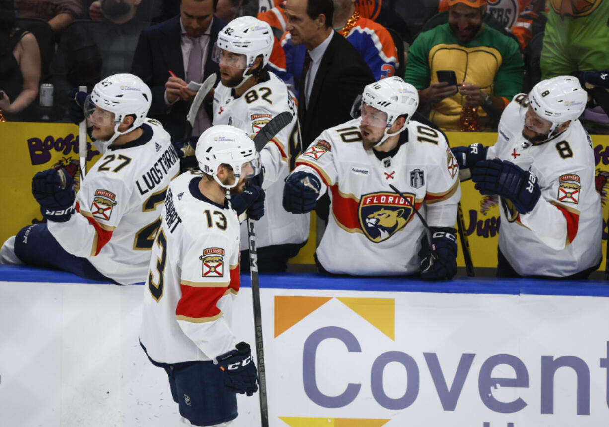 Florida Panthers&#039; Sam Reinhart (13) celebrates his goal with teammates during the first period in Game 3 of the NHL hockey Stanley Cup Finals against the Edmonton Oilers, Thursday, June 13, 2024, in Edmonton, Alberta.