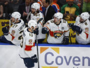 Florida Panthers&#039; Sam Reinhart (13) celebrates his goal with teammates during the first period in Game 3 of the NHL hockey Stanley Cup Finals against the Edmonton Oilers, Thursday, June 13, 2024, in Edmonton, Alberta.