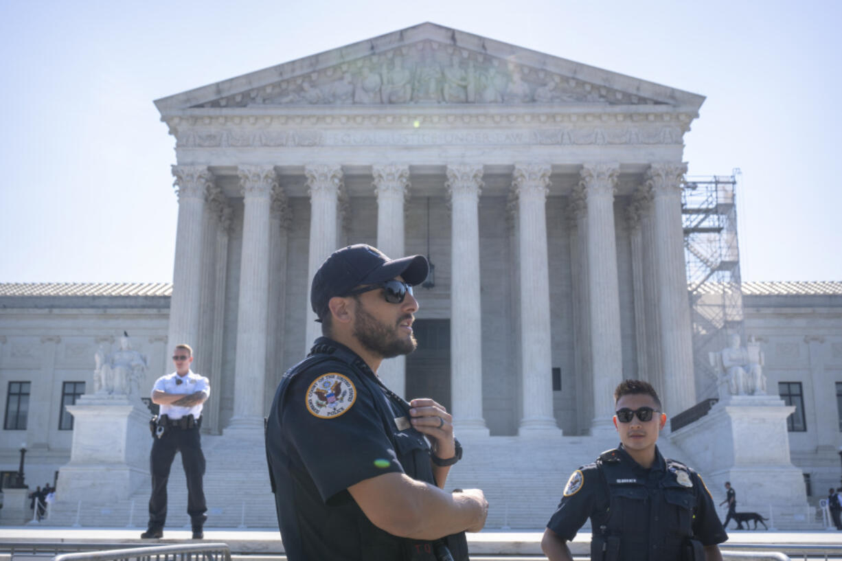 Supreme Court Police officers stand on duty outside of the Supreme Court building on Thursday, June 13, 2024, in Washington.