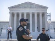 Supreme Court Police officers stand on duty outside of the Supreme Court building on Thursday, June 13, 2024, in Washington.