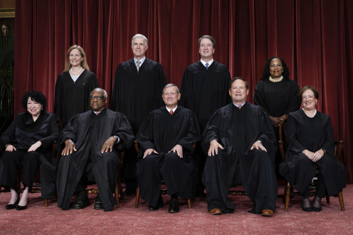 FILE - Members of the Supreme Court sit for a new group portrait following the addition of Associate Justice Ketanji Brown Jackson, at the Supreme Court building in Washington, Oct. 7, 2022. Bottom row, from left, Associate Justice Sonia Sotomayor, Associate Justice Clarence Thomas, Chief Justice of the United States John Roberts, Associate Justice Samuel Alito, and Associate Justice Elena Kagan. Top row, from left, Associate Justice Amy Coney Barrett, Associate Justice Neil Gorsuch, Associate Justice Brett Kavanaugh, and Associate Justice Ketanji Brown Jackson. (AP Photo/J.