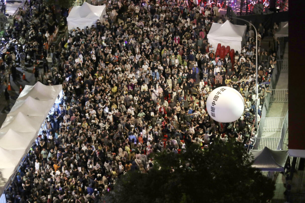 Supporters of the ruling Democratic Progressive Party (DPP) gather and push an ball reading &#039;&#039;Reject China&#039;s Interference In Politics&#039;&#039; outside of the legislative building in Taipei, Taiwan, Tuesday, May 28, 2024.