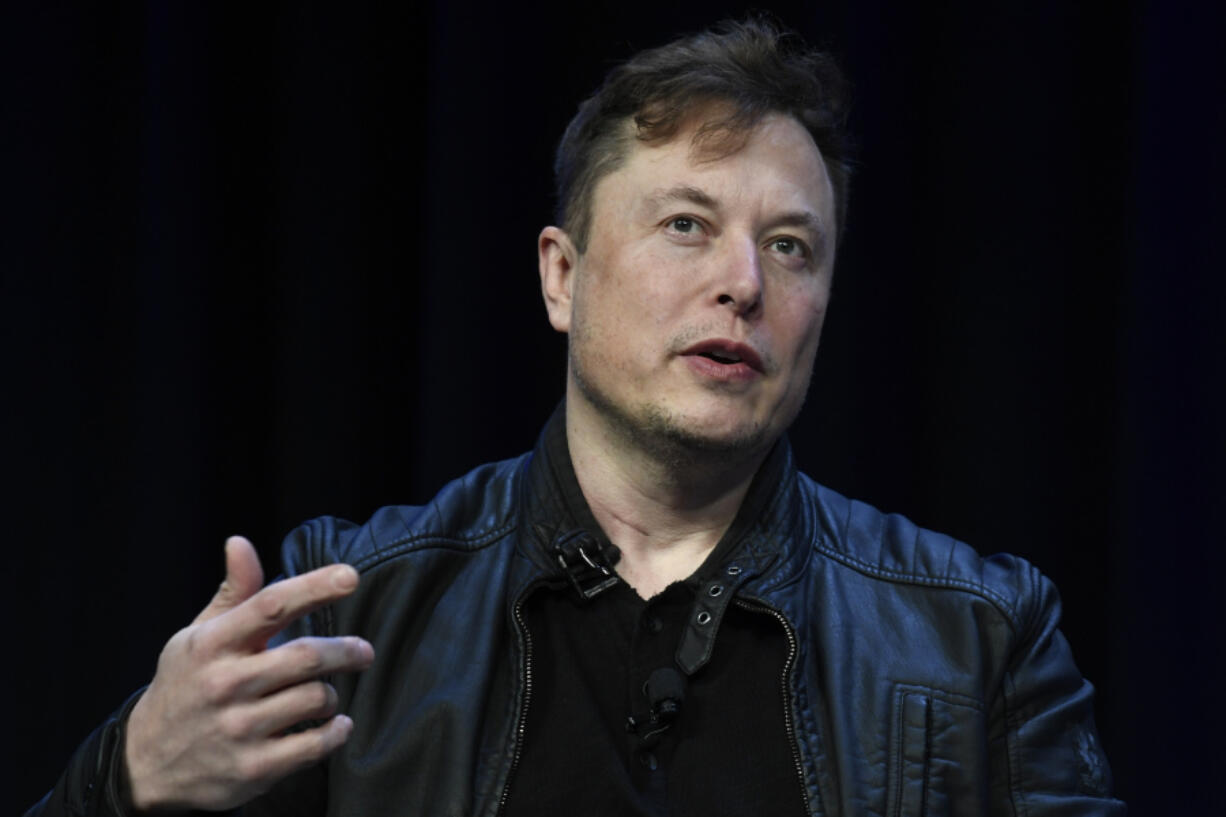 FILE - Tesla and SpaceX CEO Elon Musk speaks at the SATELLITE Conference and Exhibition in Washington, March 9, 2020. An air quality board has ordered electric car manufacturer Tesla to stop illegally polluting the air in the San Francisco Bay Area.