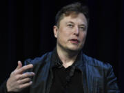 FILE - Tesla and SpaceX CEO Elon Musk speaks at the SATELLITE Conference and Exhibition in Washington, March 9, 2020. An air quality board has ordered electric car manufacturer Tesla to stop illegally polluting the air in the San Francisco Bay Area.