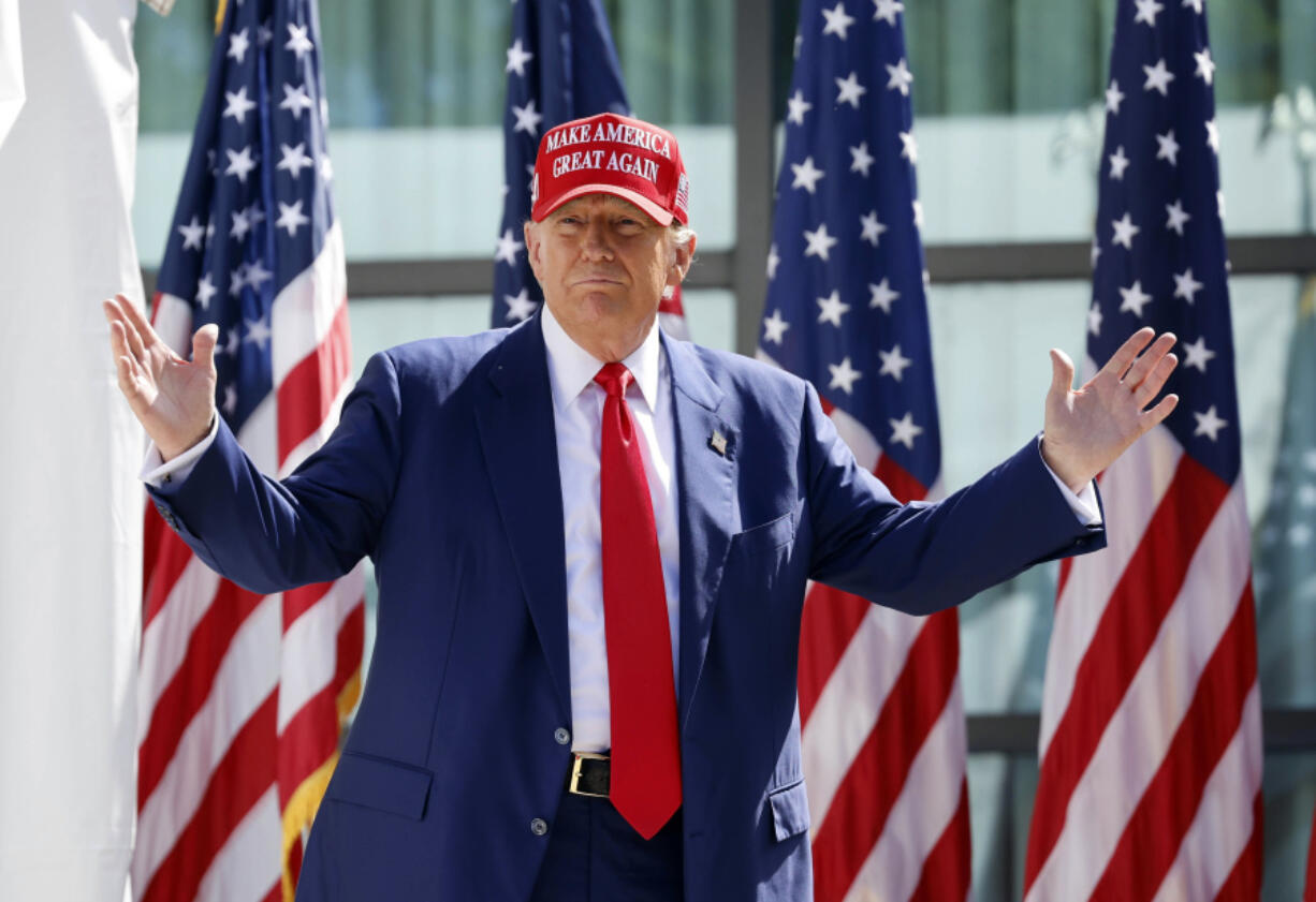 FILE - Republican presidential candidate former President Donald Trump enters at a campaign event, June 18, 2024, in Racine, Wis. Manhattan prosecutors are urging the judge overseeing Donald Trump&rsquo;s criminal hush money case to uphold a gag order that bars the Republican former president from criticizing jurors, court staff, or members of the prosecution that convicted him.