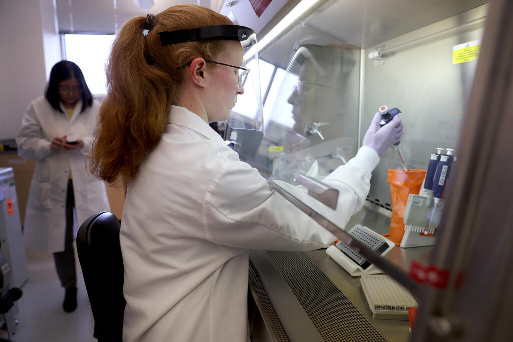 Microbiologist Anne Vandenburg-Carroll tests poultry samples collected from a farm located in a control area for the presence of avian influenza, or bird flu, at the Wisconsin Veterinary Diagnostic Laboratory at the University of Wisconsin-Madison on March 24, 2022, in Madison, Wisconsin.