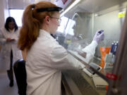 Microbiologist Anne Vandenburg-Carroll tests poultry samples collected from a farm located in a control area for the presence of avian influenza, or bird flu, at the Wisconsin Veterinary Diagnostic Laboratory at the University of Wisconsin-Madison on March 24, 2022, in Madison, Wisconsin.