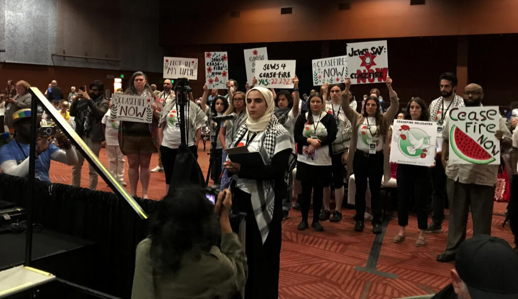 Safa Peera, of Seattle, speaks at the Washington State Democrats convention on Sunday, June 23, 2024, in Bellevue, Washington. State Democrats passed three resolutions concerning the war in Gaza, including a call for a ceasefire.