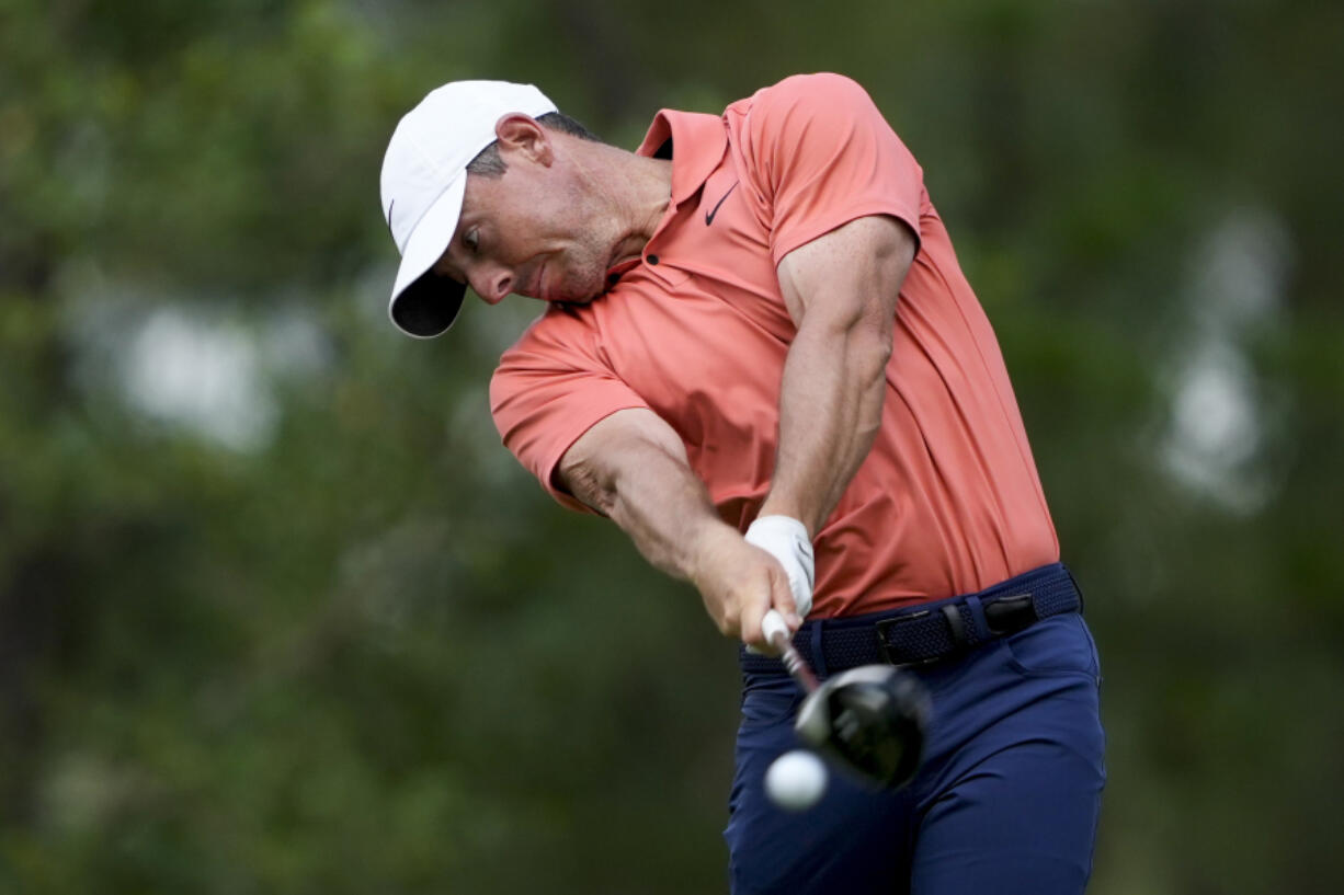 Rory McIlroy, of Northern Ireland, hits his tee shot on the 11th hole during the first round of the U.S. Open.