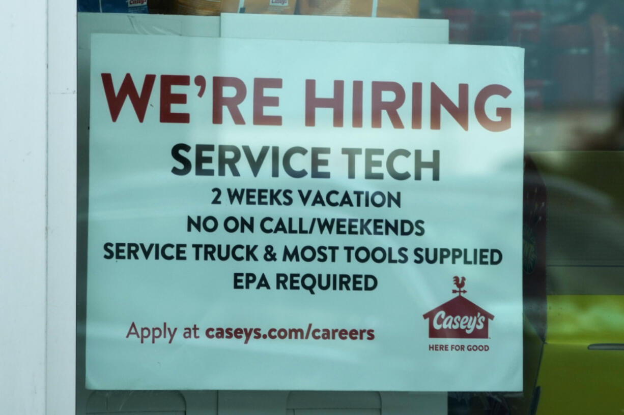 A hiring sign is displayed at a gas station in Vernon Hills, Ill., Monday, June 3, 2024. On Thursday, June 13, 2024, the Labor Department reports on the number of people who applied for unemployment benefits last week. (AP Photo/Nam Y.