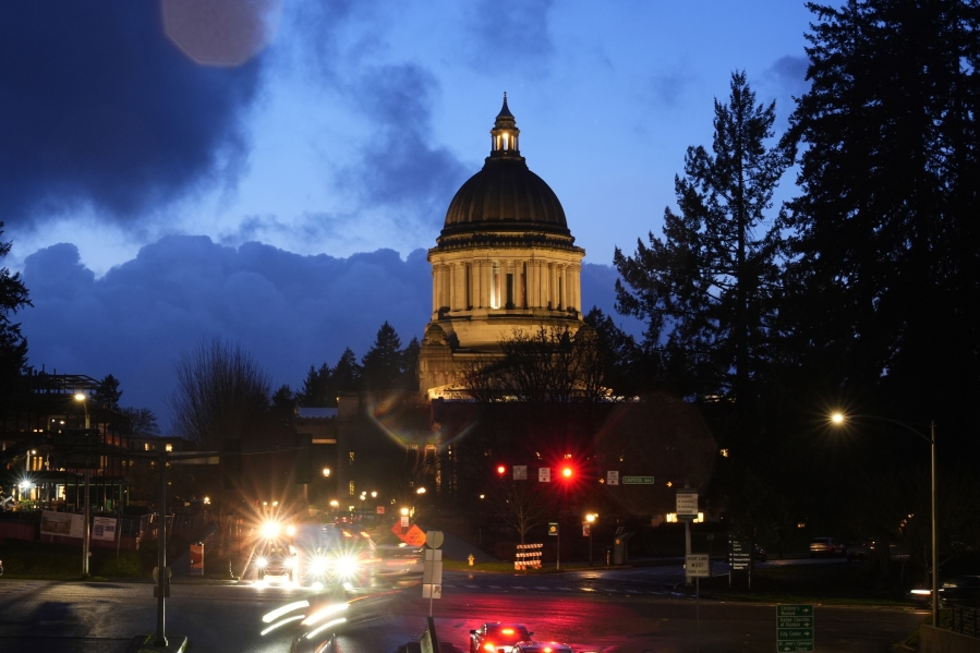 FILE - The Washington state Capitol building is pictured, Tuesday, Jan. 9, 2024, in Olympia, Wash. A new Washington state parental rights law derided by critics as a &quot;forced outing&quot; measure will be allowed to take effect this week after a court commissioner on Tuesday declined to issue an emergency order temporarily blocking it.