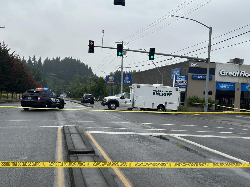 Authorities investigate Monday morning at the scene along Northeast Andresen Road where a Vancouver police officer fatally shot a man who had reportedly brandished a gun.