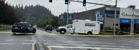 Authorities investigate Monday morning at the scene along Northeast Andresen Road where a Vancouver police officer fatally shot a man who had reportedly brandished a gun.