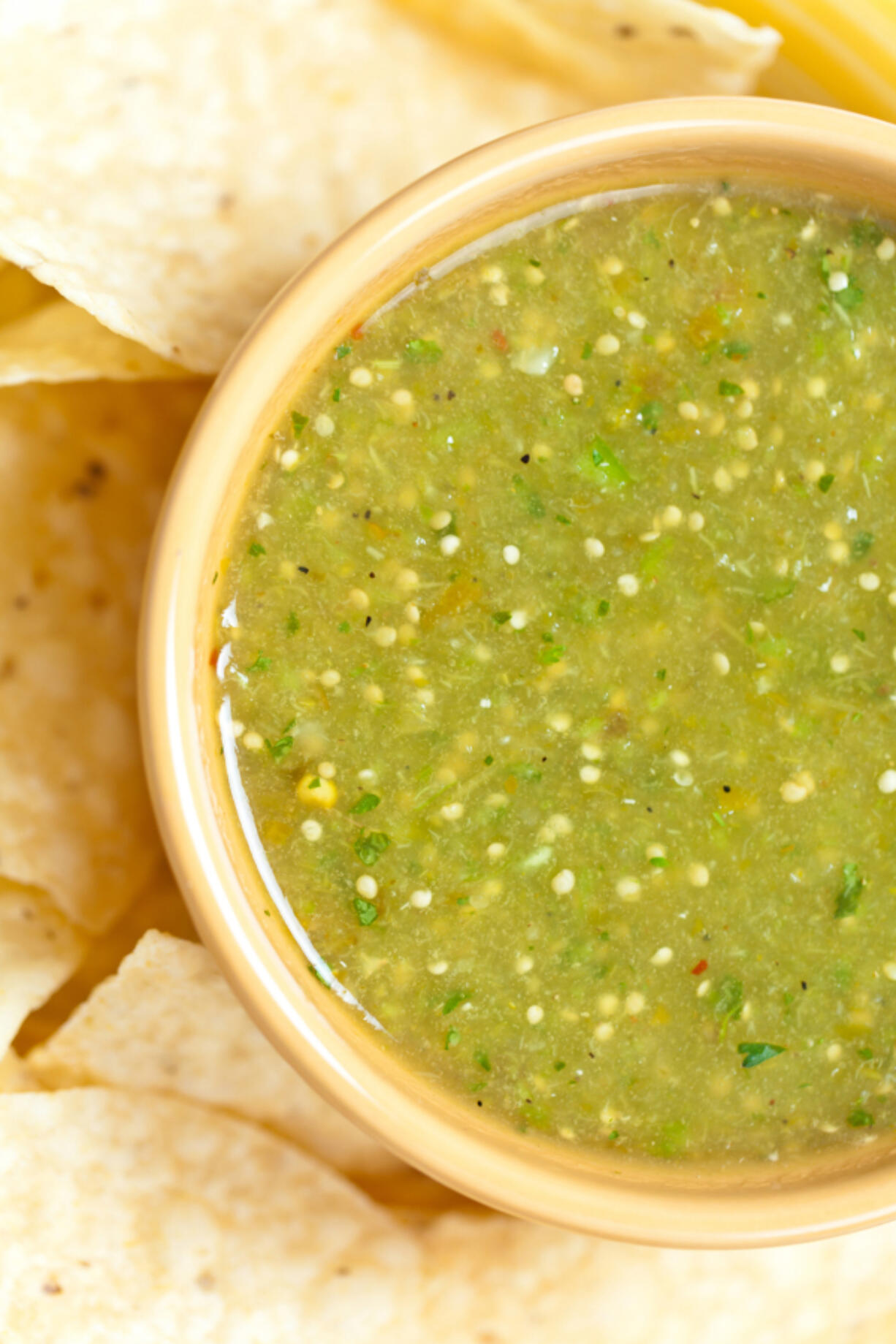 Salsa verde with tortilla chips.