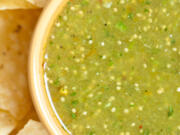 Salsa verde with tortilla chips.