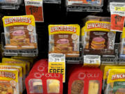 Packages of Lunchables are displayed on a shelf at a Safeway store on April 10 in San Anselmo, Calif. Consumer Reports is asking for the Department of Agriculture to eliminate Lunchables food kits from the National School Lunch Program after finding high levels of lead, sodium and cadmium in tested kits.