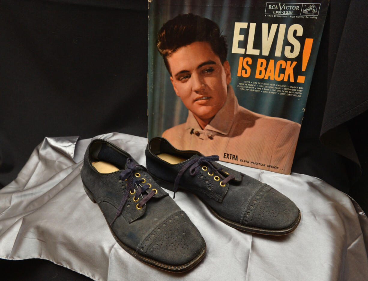 Elvis Presley&rsquo;s blue suede shoes from 1960 on display at &ldquo;Icons &amp; Idols: Rock n&rsquo; Roll&rdquo; on Dec. 3, 2013, in New York.