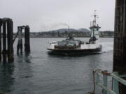 The M/V Guemes crosses the channel between Anacortes and Guemes Island. The 45-year-old vessel is scheduled to be replaced by a newer model, paid for with cap-and-invest dollars, unless voters decide to kill that program in the fall election.