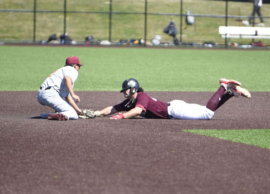 Ridgefield Raptors baserunner Hunter Katschke, right, is tagged out trying to steal second base by Corvallis Knights shortstop Ty Yukumoto during a West Coast League baseball game on Thursday, July 4, 2024 at Ridgefield Outdoor Recreation Complex.