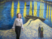 Nancy Nemhauser stands outside of her home, which is painted like van Gogh&rsquo;s &ldquo;Starry Night,&rdquo; on June 27 in Mount Dora, Fla.