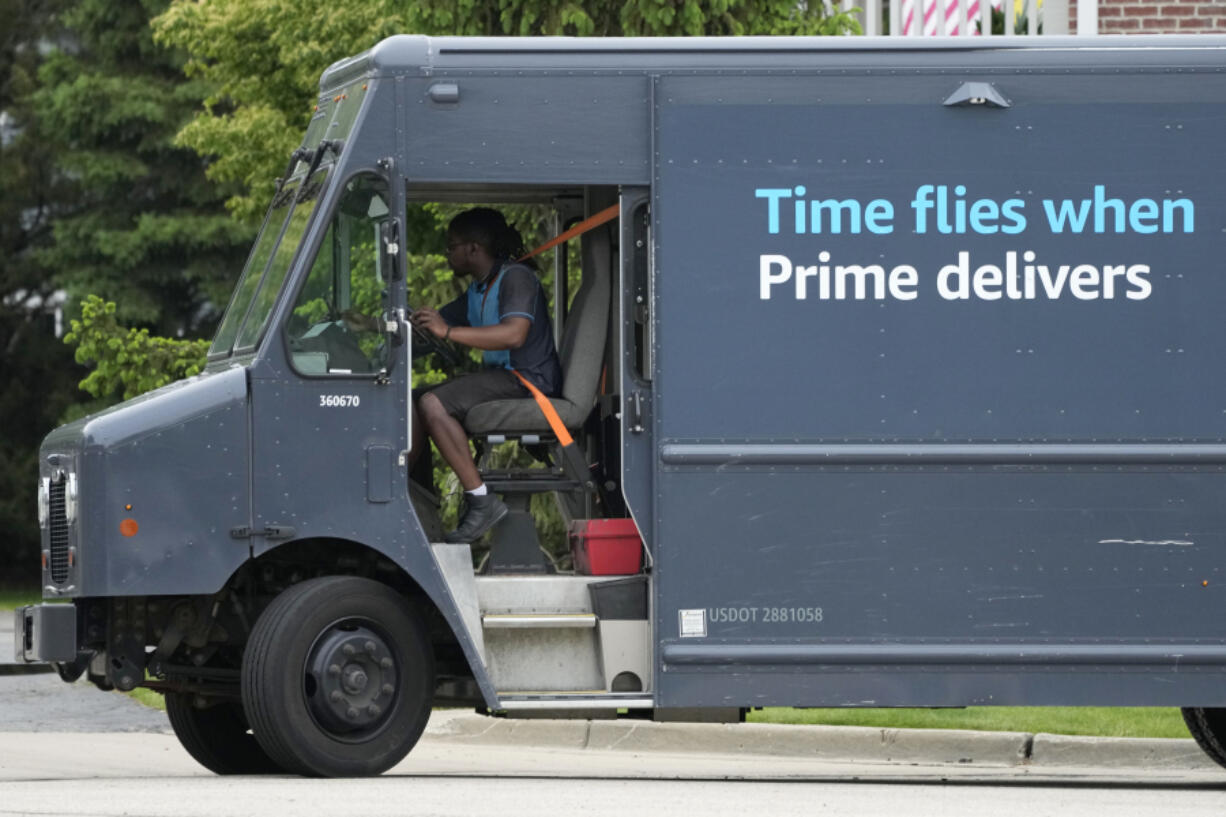 A Amazon truck makes deliveries in Wheeling, Ill., Thursday, May 16, 2024. (AP Photo/Nam Y.