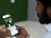 This screengrab taken from AFPTV video footage on April 27shows choreographer Sahil Kumar watching his dance video uploaded on social media platform Instagram, at a studio in Rohtak, India.