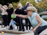 Nancy Myers of the &Ccedil;&fnof;&uacute;I Liff Bocce&Ccedil;&fnof;&ugrave; team lines up her ball during play for the Pacific Palisades Bocce League.