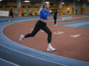 Hurdler Anna Ryzhykova trains Jan. 8 at the sports center in Kyiv, Ukraine. Ryzhykova lost a mentor who helped ignite her passion for sports. Coach Valentyn Vozniuk and his wife, Iryna Tymoshenko, were among 46 people killed by a supersonic missile that slammed into an apartment building in Dnipro in 2023.